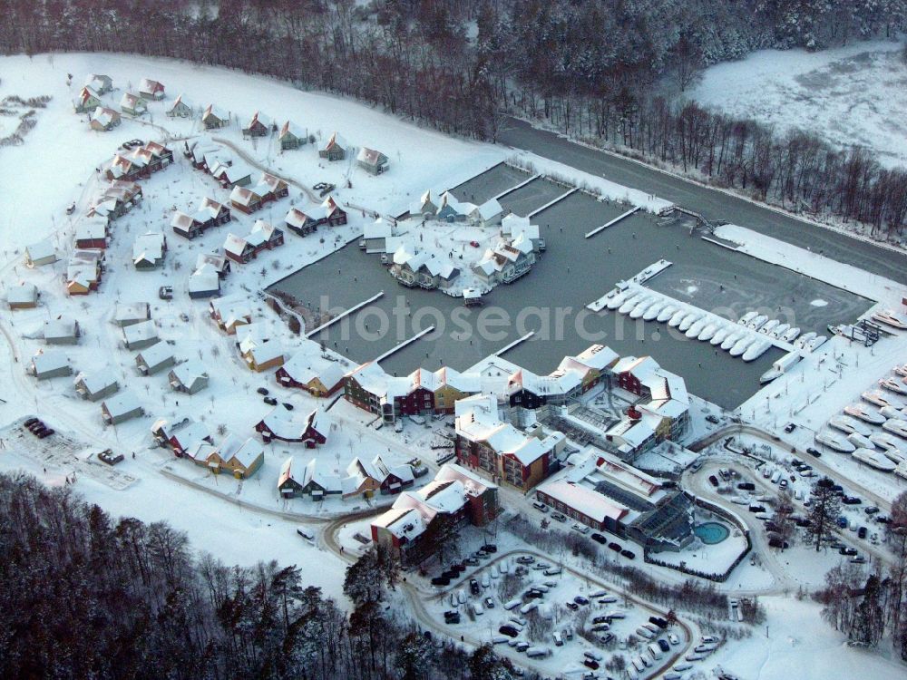 Kleinzerlang from above - Wintry snowy holiday house plant of the park Marina Wolfsbruch in Kleinzerlang in the state Brandenburg, Germany