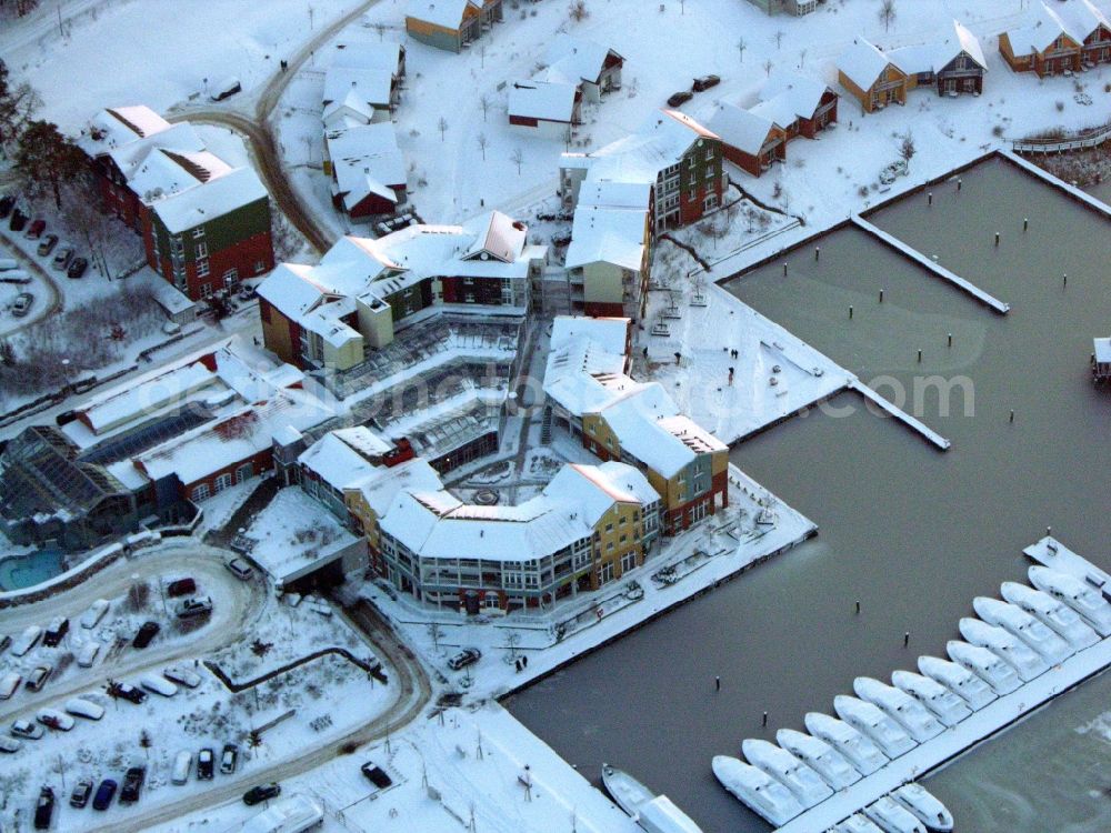 Aerial photograph Kleinzerlang - Wintry snowy holiday house plant of the park Marina Wolfsbruch in Kleinzerlang in the state Brandenburg, Germany