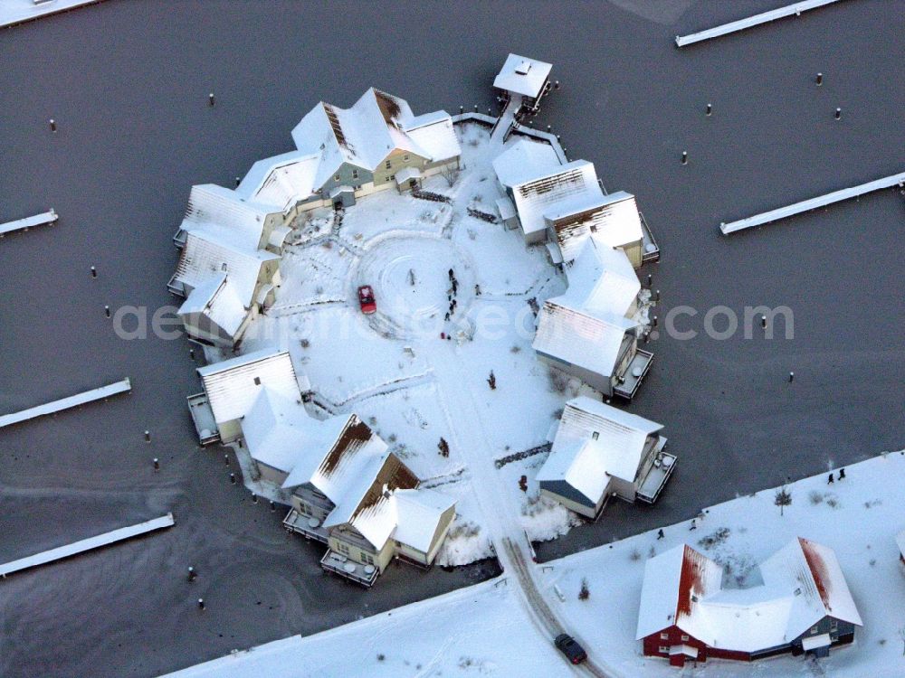 Aerial image Kleinzerlang - Wintry snowy holiday house plant of the park Marina Wolfsbruch in Kleinzerlang in the state Brandenburg, Germany