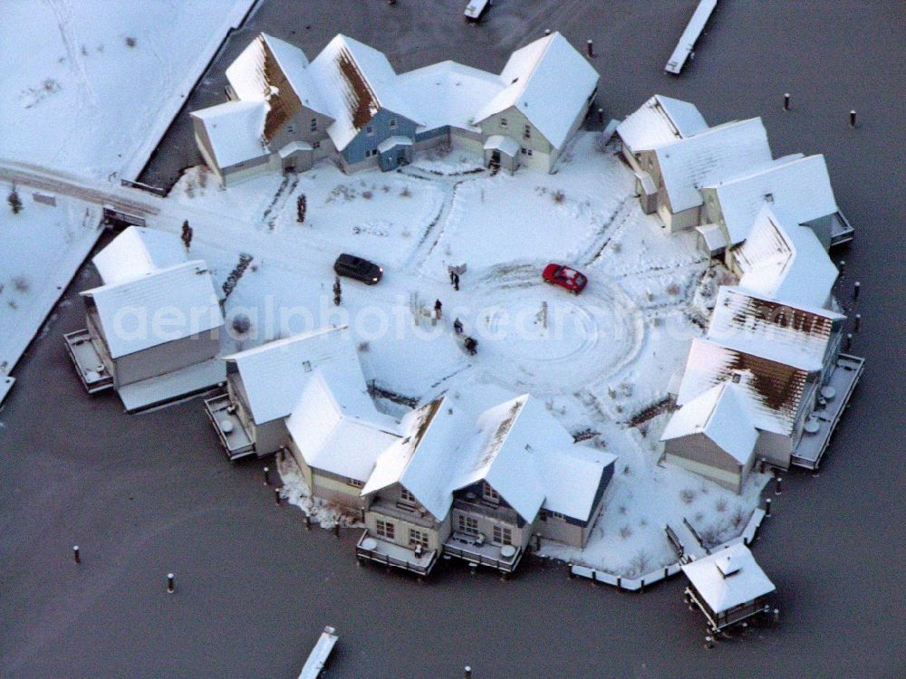 Kleinzerlang from above - Wintry snowy holiday house plant of the park Marina Wolfsbruch in Kleinzerlang in the state Brandenburg, Germany