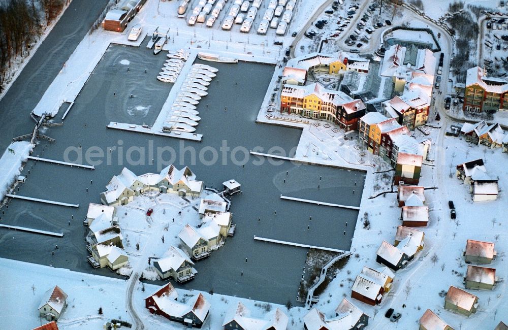 Kleinzerlang from above - Wintry snowy holiday house plant of the park Marina Wolfsbruch in Kleinzerlang in the state Brandenburg, Germany