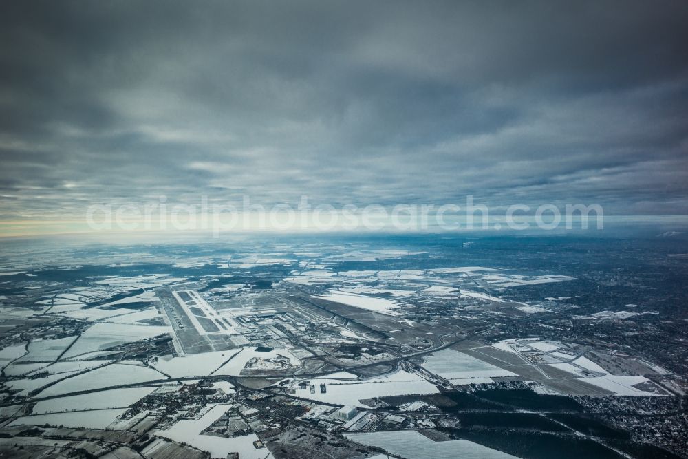 Aerial photograph Schönefeld - Wintery, snow-covered airport Berlin Brandenburg in Schoenefeld in the state of Brandenburg