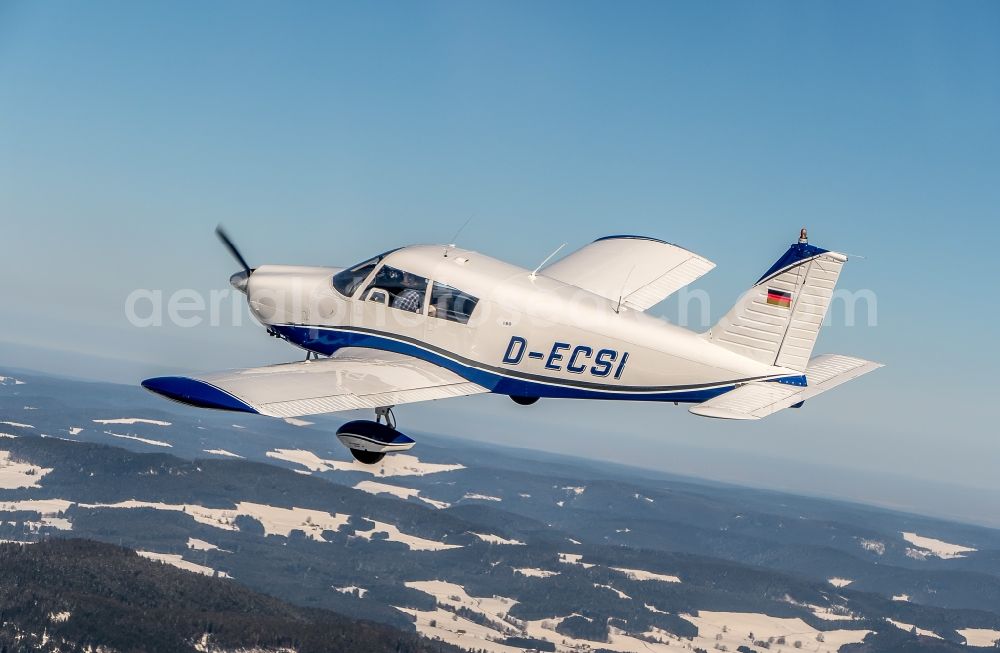 Feldberg (Schwarzwald) from above - Wintry snowy piper Pa28 Aircraft in flight over the airspace in Feldberg (Schwarzwald) in the state Baden-Wurttemberg, Germany