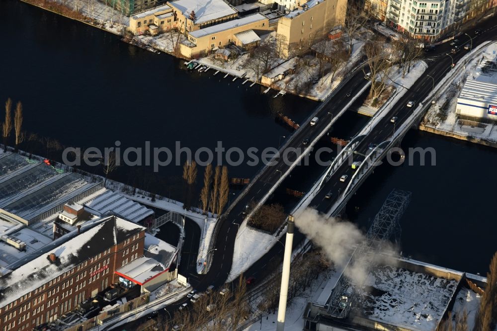 Berlin from above - Wintry snowy river - bridge construction across the river Spree in the district Bezirk Treptow-Koepenick in Berlin