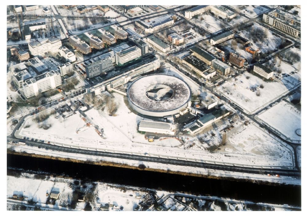 Berlin from the bird's eye view: Wintry snowy research building and office complex Elektronen- Speicherring BESSY - Synchrotronstrahlungsquelle in the district Adlershof in Berlin, Germany