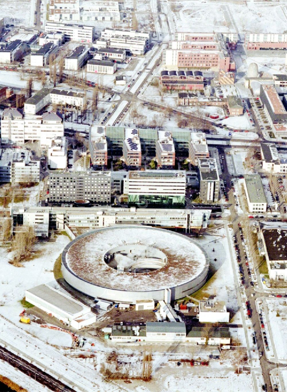 Berlin from the bird's eye view: Wintry snowy research building and office complex Elektronen- Speicherring BESSY - Synchrotronstrahlungsquelle in the district Adlershof in Berlin, Germany