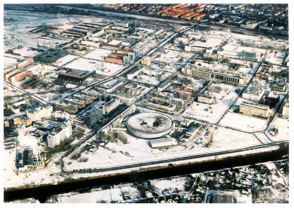 Berlin from the bird's eye view: Wintry snowy research building and office complex Elektronen- Speicherring BESSY - Synchrotronstrahlungsquelle in the district Adlershof in Berlin, Germany