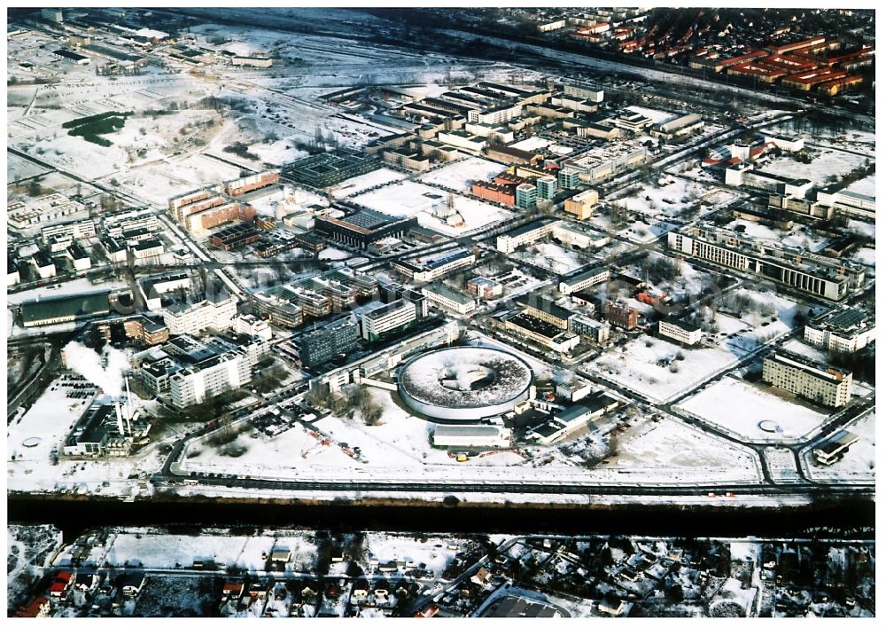 Aerial image Berlin - Wintry snowy research building and office complex Elektronen- Speicherring BESSY - Synchrotronstrahlungsquelle in the district Adlershof in Berlin, Germany