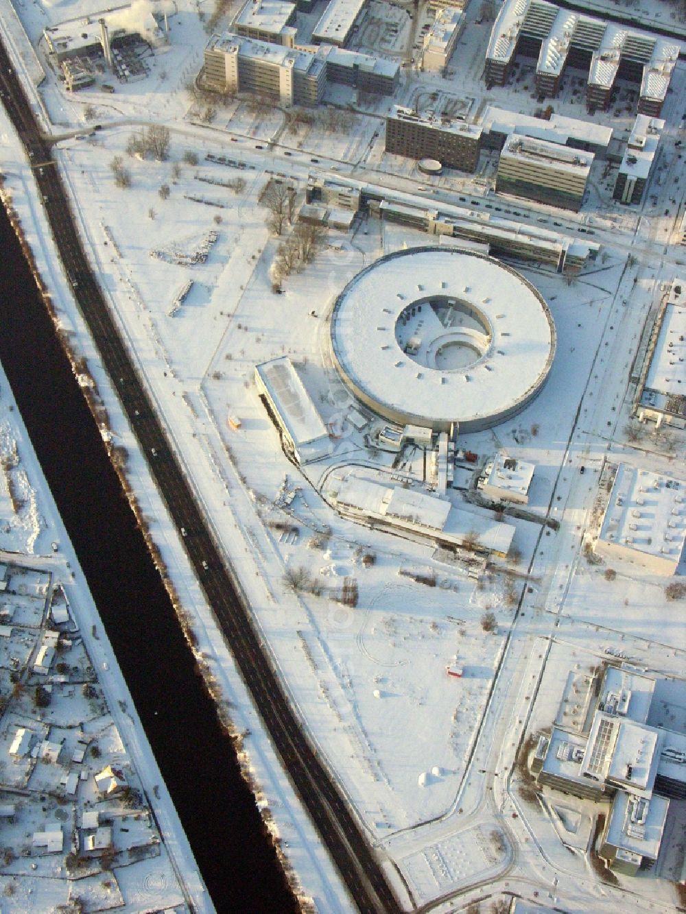 Berlin from the bird's eye view: Wintry snowy research building and office complex Elektronen- Speicherring BESSY - Synchrotronstrahlungsquelle in the district Adlershof in Berlin, Germany