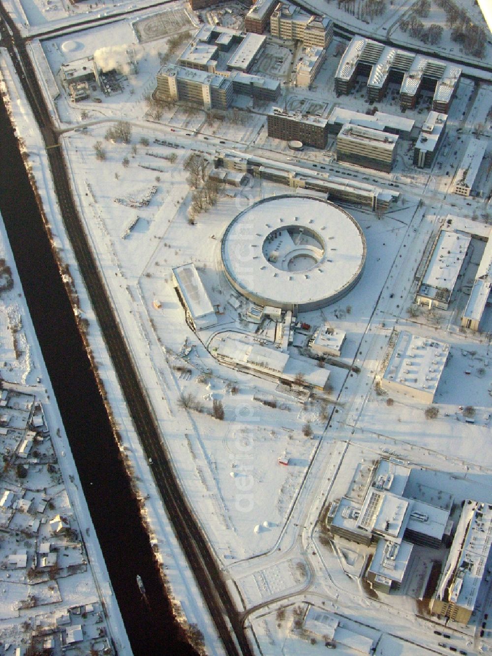 Berlin from above - Wintry snowy research building and office complex Elektronen- Speicherring BESSY - Synchrotronstrahlungsquelle in the district Adlershof in Berlin, Germany