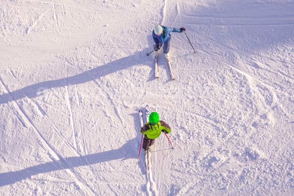 Ellmau from above - Wintry snowy Leisure Centre with skier - Amusement Park SkiWelt Wilder Kaiser-Brixental in Ellmau in Tirol, Austria