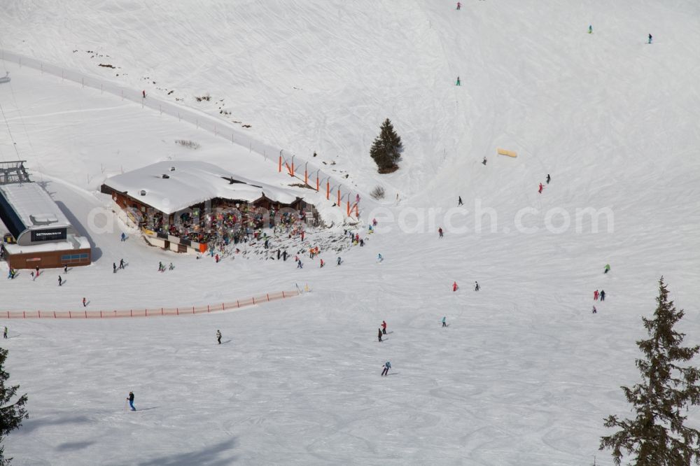 Ellmau from above - Wintry snowy Leisure Centre with skier - Amusement Park SkiWelt Wilder Kaiser-Brixental in Ellmau in Tirol, Austria