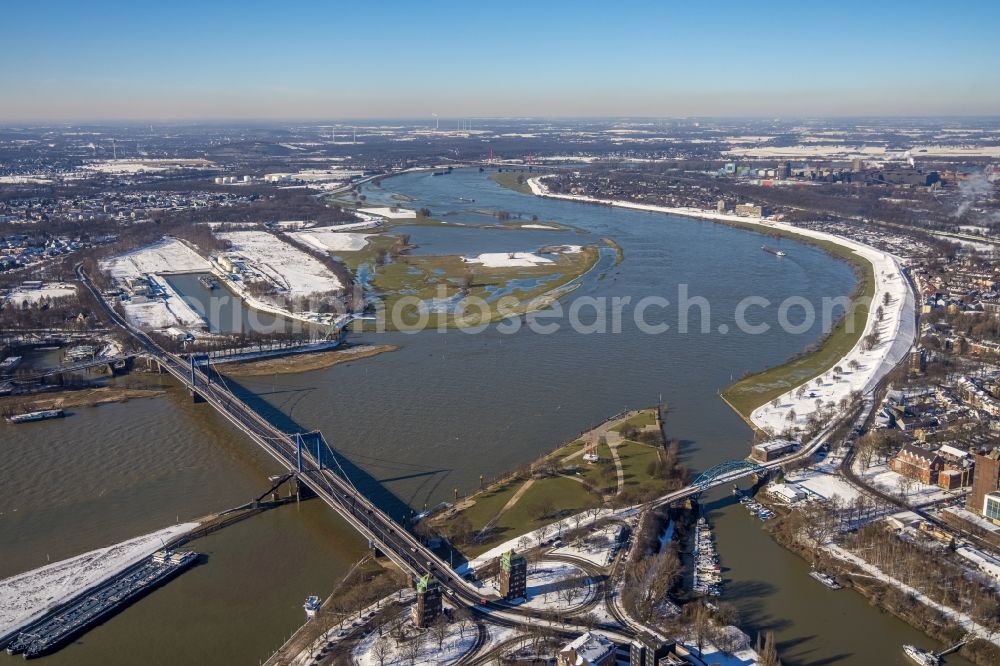 Aerial image Duisburg - Wintry snowy Friedrich-Ebert-Bruecke between the districts of Ruhrort and Homberg in Duisburg in the Ruhr area in the state of North Rhine-Westphalia