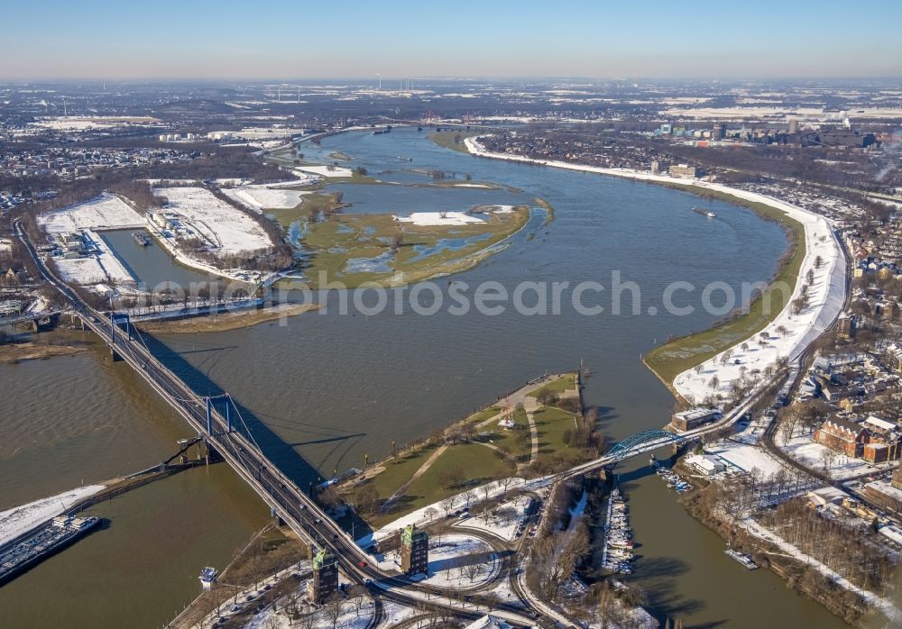 Aerial image Duisburg - Wintry snowy Friedrich-Ebert-Bruecke between the districts of Ruhrort and Homberg in Duisburg in the Ruhr area in the state of North Rhine-Westphalia