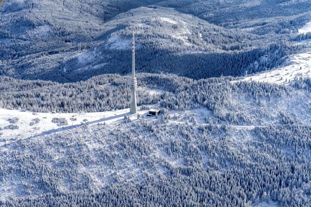 Seebach from above - Wintry snowy Radio tower and transmitter on the crest of the mountain range SWR-Sendeturm on Bergruecken Hornisgrinde in Seebach in the state Baden-Wurttemberg