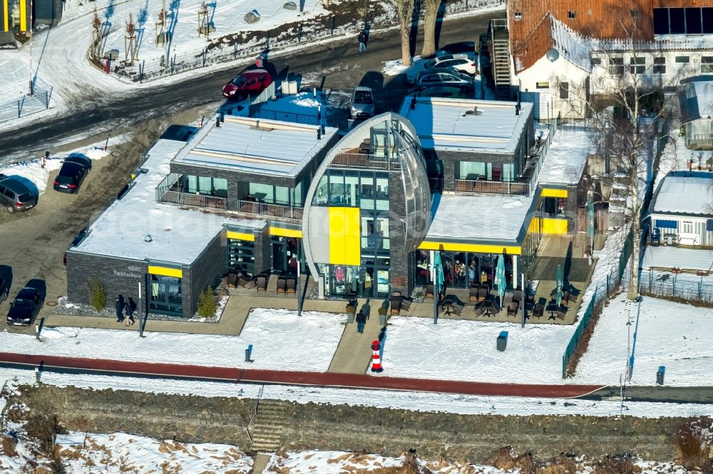 Aerial image Möhnesee - Wintry snow-covered building of the ADAC yacht and sail school in the district of Koerbecke in Moehnesee in the federal state North Rhine-Westphalia