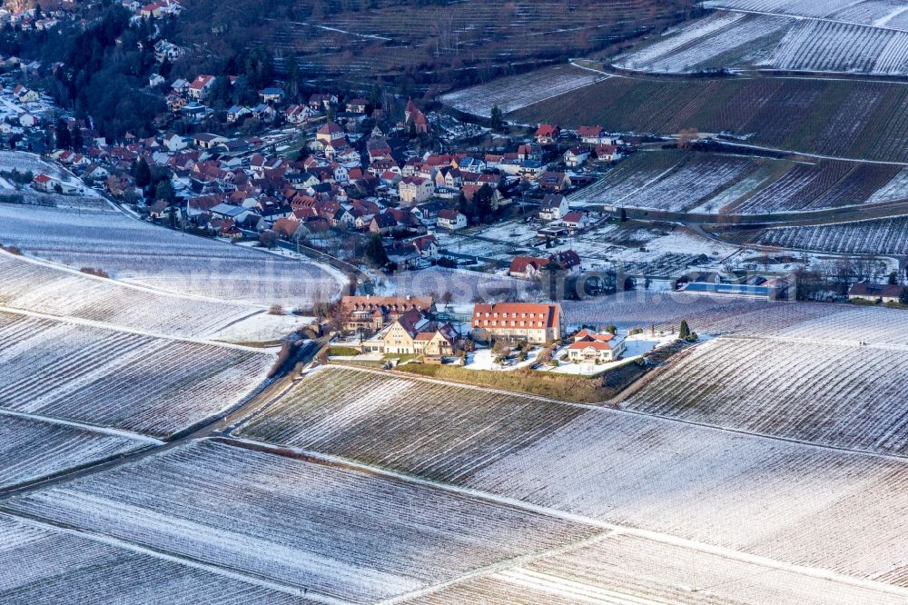 Leinsweiler from the bird's eye view: Wintry snowy Complex of the hotel building Leinsweiler Hof in Leinsweiler in the state Rhineland-Palatinate, Germany