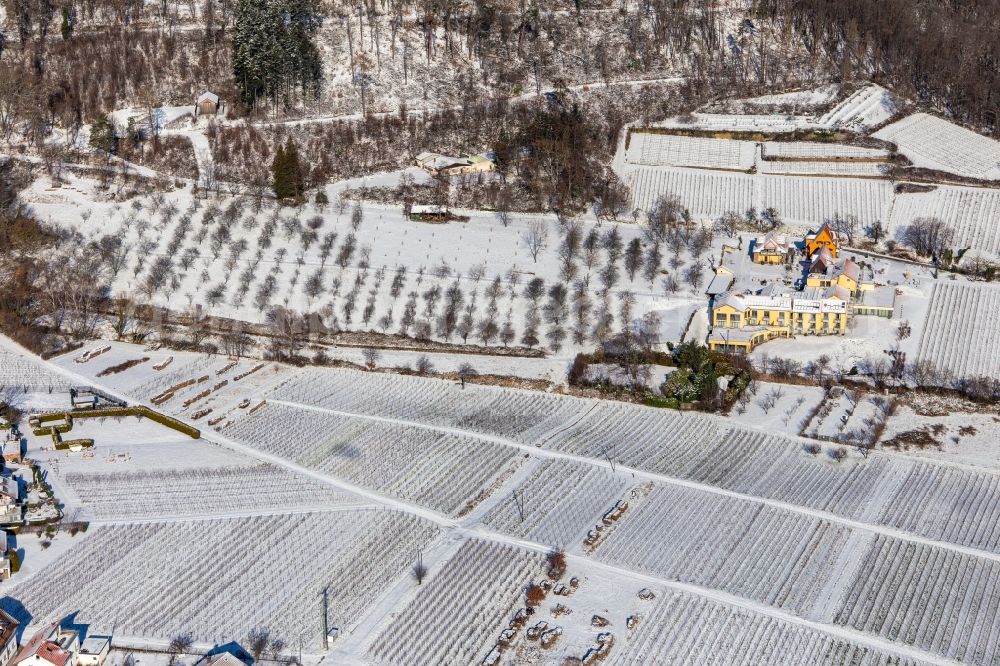 Rhodt unter Rietburg from above - Wintry snowy complex of the hotel building Wohlfuehlhotel Alte Rebschule and Gasthaus Sesel in springtime in Rhodt unter Rietburg in the state Rhineland-Palatinate, Germany