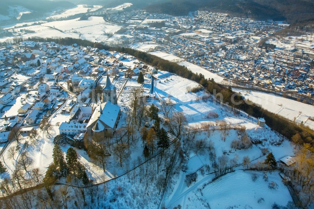 Marsberg from the bird's eye view: Wintry snowy complex of buildings of the cloister arrangement Upper Mars mountain with pencil church and cemetery in Mars mountain in the federal state North Rhine-Westphalia