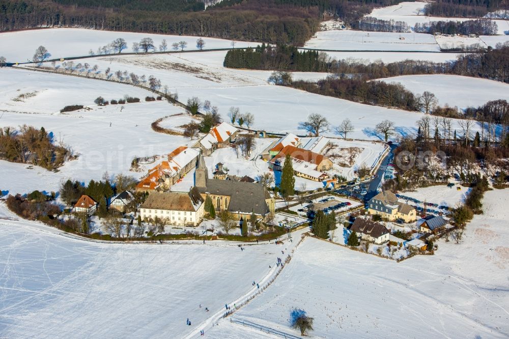 Aerial photograph Arnsberg - Wintry snowy Complex of buildings of the monastery Oelinghausen in the district Holzen in Arnsberg in the state North Rhine-Westphalia