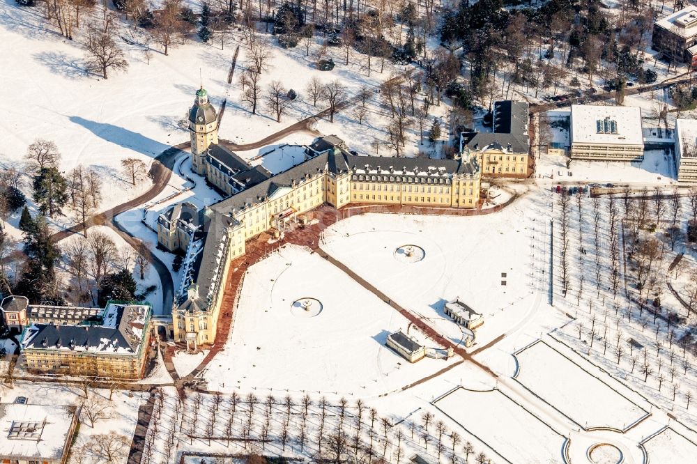 Karlsruhe from the bird's eye view: Wintry snowy Building complex in the park of the castle Schloss Karlsruhe in Karlsruhe in the state Baden-Wuerttemberg, Germany