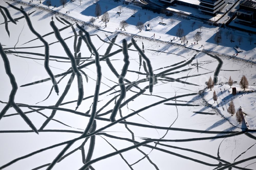 Aerial photograph Dortmund - Wintry snowy traces on the frozen and ice-covered water surface PhoenixSee in the district Hoerde in Dortmund at Ruhrgebiet in the state North Rhine-Westphalia, Germany