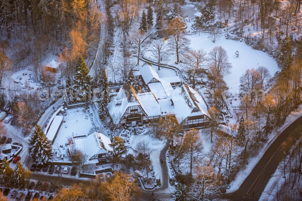 Möhnesee from above - Wintry snow-covered and snowy area and building of the restaurant Torhaus Moehnesee in Moehnesee in the federal state North Rhine-Westphalia