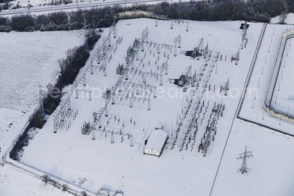 Rosdorf from above - Wintry snowy Site of the substation for voltage conversion and electrical power supply Rosdorf in Rosdorf in the state Lower Saxony, Germany