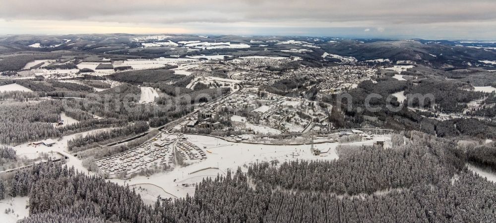 Aerial image Winterberg - Wintry snowy city area with outside districts and inner city area in Winterberg at Sauerland in the state North Rhine-Westphalia, Germany