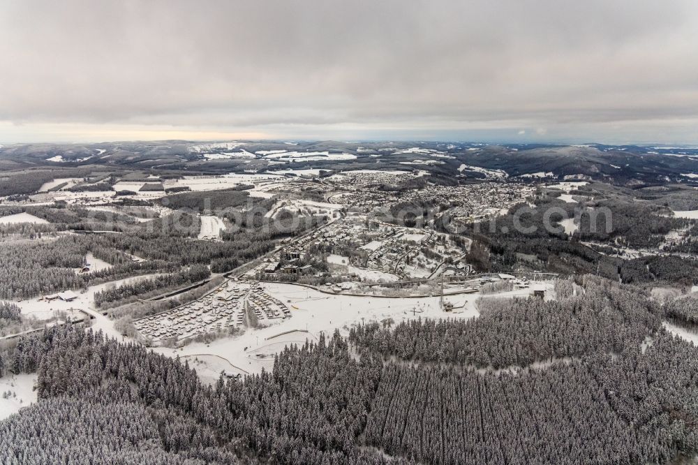 Aerial photograph Winterberg - Wintry snowy city area with outside districts and inner city area in Winterberg at Sauerland in the state North Rhine-Westphalia, Germany