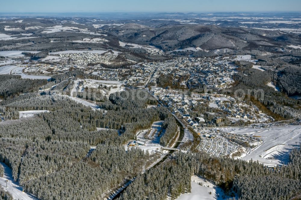 Winterberg from above - Wintry snowy city area with outside districts and inner city area in Winterberg at Sauerland in the state North Rhine-Westphalia, Germany