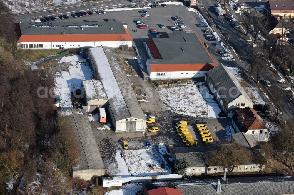 Werneuchen from above - Wintry snowy Industrial estate and company settlement Freienwalder Strasse in Werneuchen in the state Brandenburg