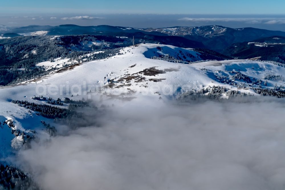 Feldberg (Schwarzwald) from the bird's eye view: Wintry snowy Rocky and mountainous landscape of Feldberg in Feldberg (Schwarzwald) in the state Baden-Wuerttemberg, Germany