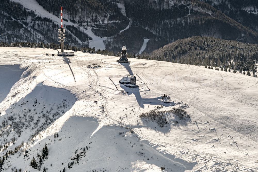 Aerial photograph Feldberg (Schwarzwald) - Wintry snowy rocky and mountainous landscape Am Feldberg with neuem Feldbergturm and Wetterwarte in Herbst in Feldberg (Schwarzwald) in the state Baden-Wurttemberg, Germany