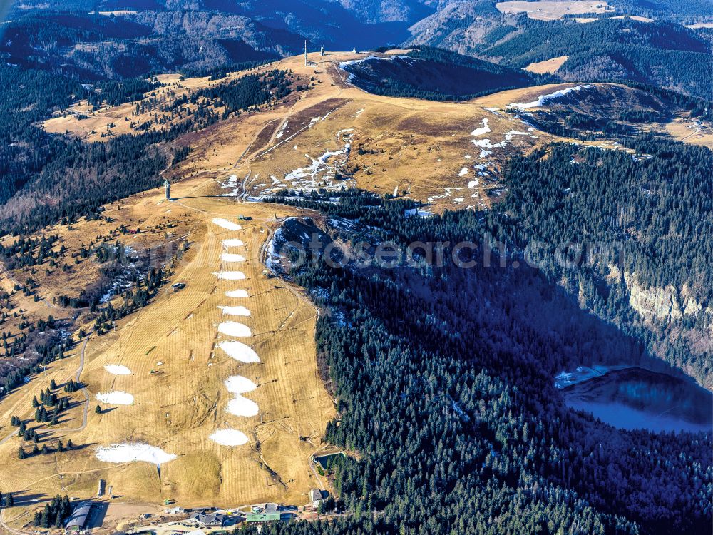 Feldberg (Schwarzwald) from the bird's eye view: Wintry snowy rocky and mountainous landscape in Feldberg (Schwarzwald) at Schwarzwald in the state Baden-Wuerttemberg, Germany