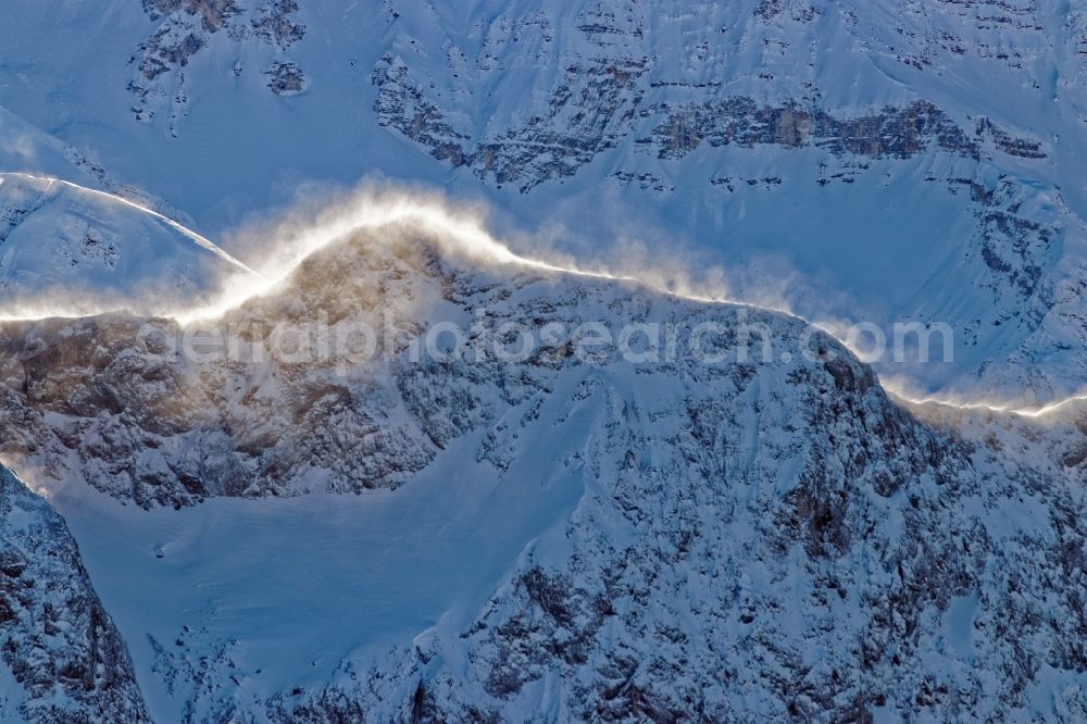 Aerial image Leutasch - Winter aerial view Peaks and ridges with snowdrifts in the backlight in the rock and mountain landscape of the Alps near Seefeld in Tirol in Austria