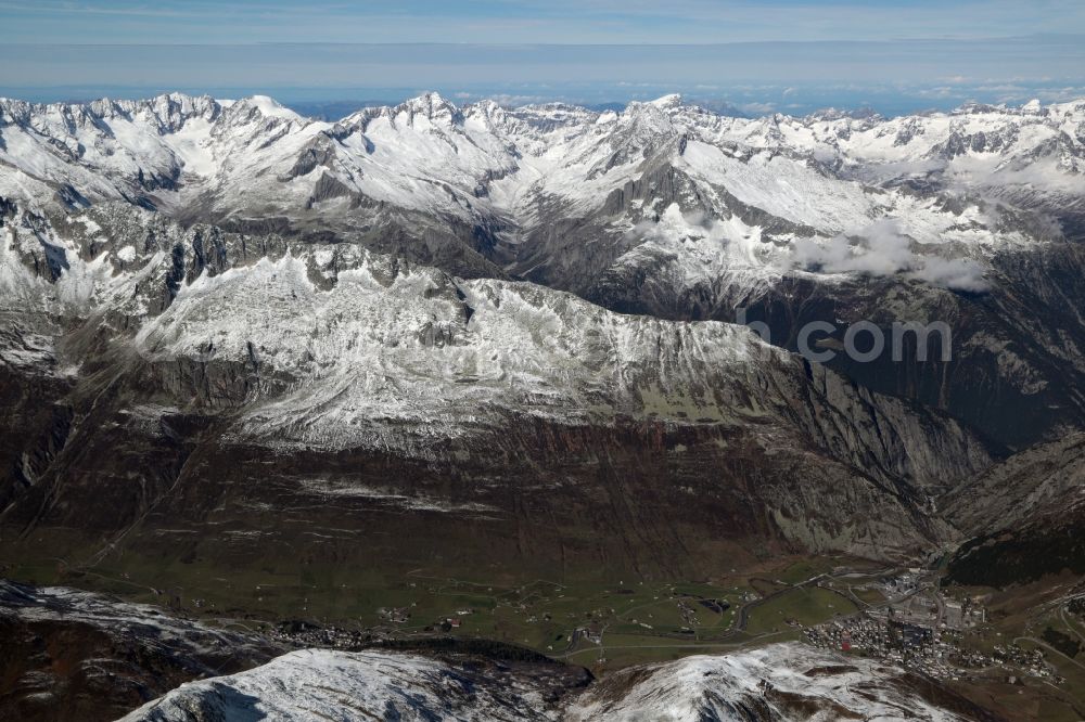 Andermatt from the bird's eye view: Wintry snowy Rocky and mountainous landscape of the Urner Alps at Andermatt in the canton Uri, Switzerland