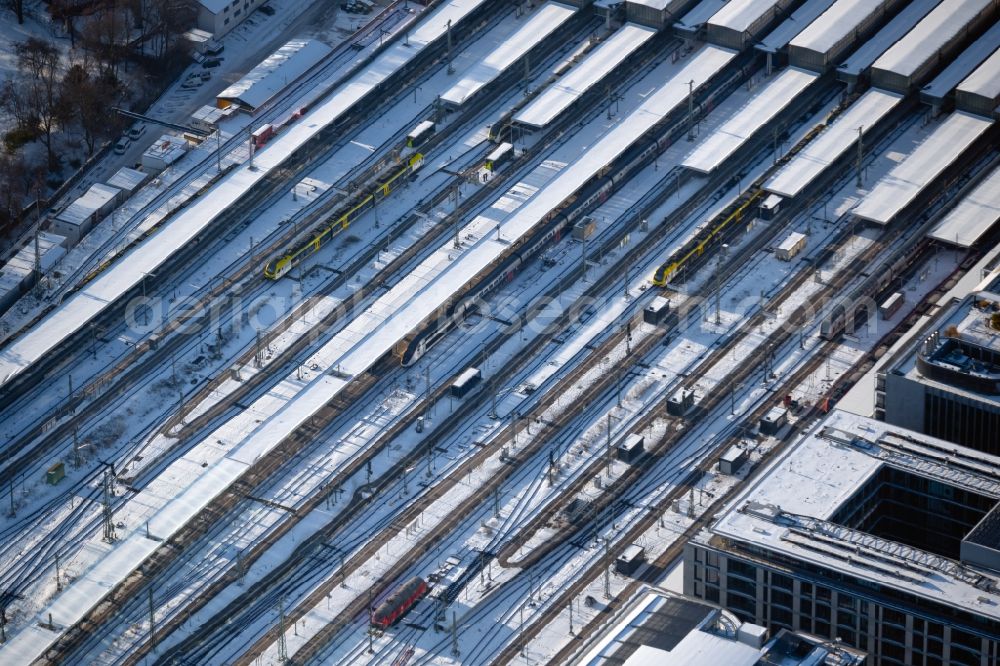 Stuttgart from the bird's eye view: Wintry snowy track progress and building of the main station of the railway in the district Stadtzentrum in Stuttgart in the state Baden-Wuerttemberg, Germany