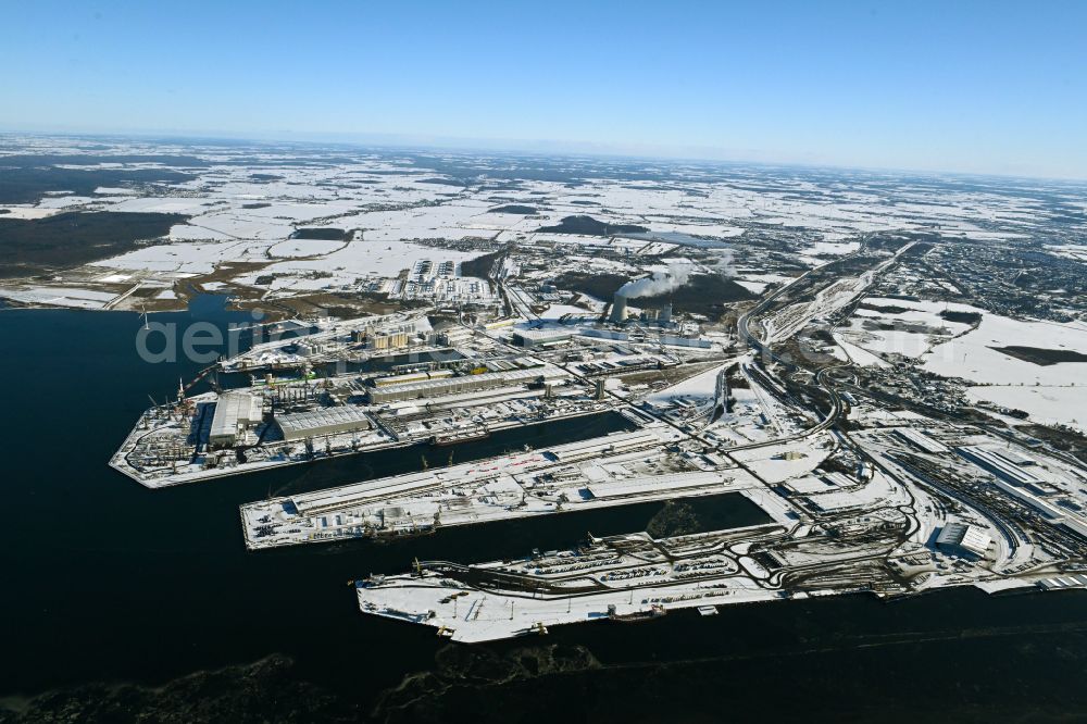 Aerial photograph Rostock - Wintry snowy port facilities on the shores of the harbor of of Seehafen of ROSTOCK PORT GmbH in the district Peez in Rostock at the baltic sea coast in the state Mecklenburg - Western Pomerania, Germany