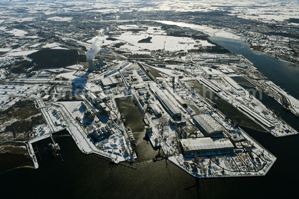 Aerial photograph Rostock - Wintry snowy port facilities on the shores of the harbor of of Seehafen of ROSTOCK PORT GmbH in the district Peez in Rostock at the baltic sea coast in the state Mecklenburg - Western Pomerania, Germany