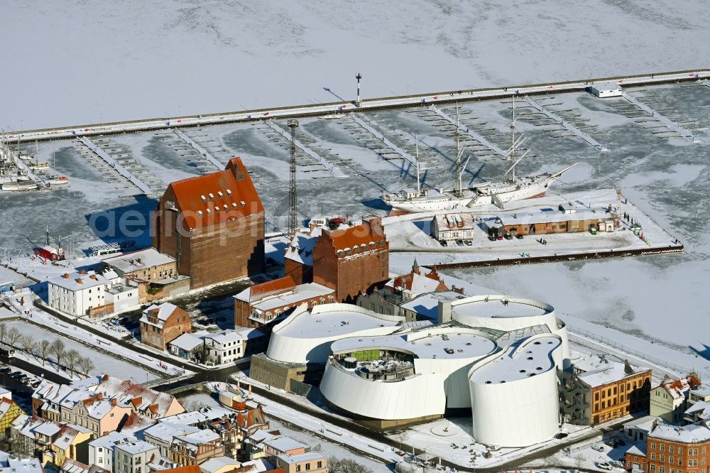 Stralsund from above - Wintry snowy harbor island by Ozeaneum Oceanographic Museum in Stralsund in Mecklenburg - Western Pomerania