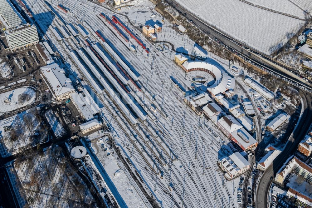 Würzburg from above - Wintry snowy track progress and building of the main station of the railway in Wuerzburg in the state Bavaria, Germany