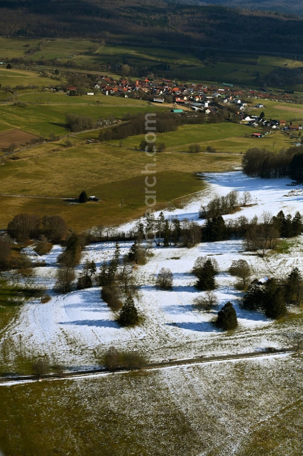 Kalbach from above - Wintry snowy wavy grass surface structures of a hilly landscape on Frauenstein in the district Heubach in Kalbach in the state Hesse, Germany