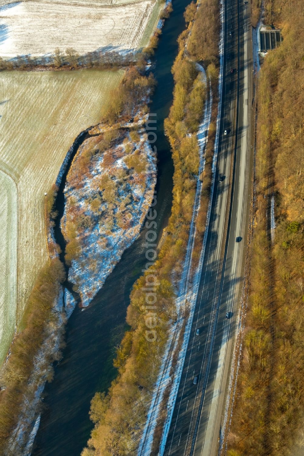 Aerial image Arnsberg - Wintery air picture - island on the shore of the river course of the Ruhr in parallel with the highway A445 near home Ne in Arnsberg in the federal state North Rhine-Westphalia