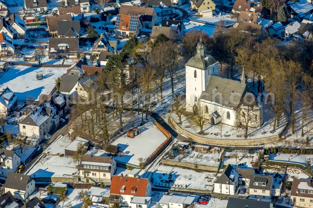 Warstein from the bird's eye view: Wintry snowy Church building in Warstein in the state North Rhine-Westphalia