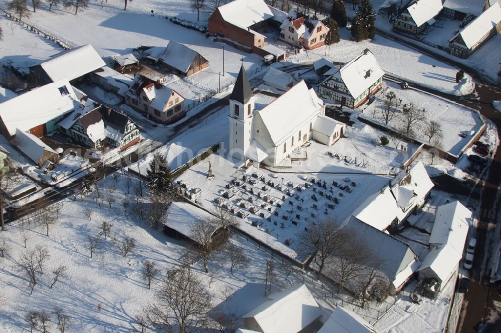 Aerial image Eberbach-Seltz - Wintry snowy Church building in the village of in Eberbach-Seltz in Grand Est, France