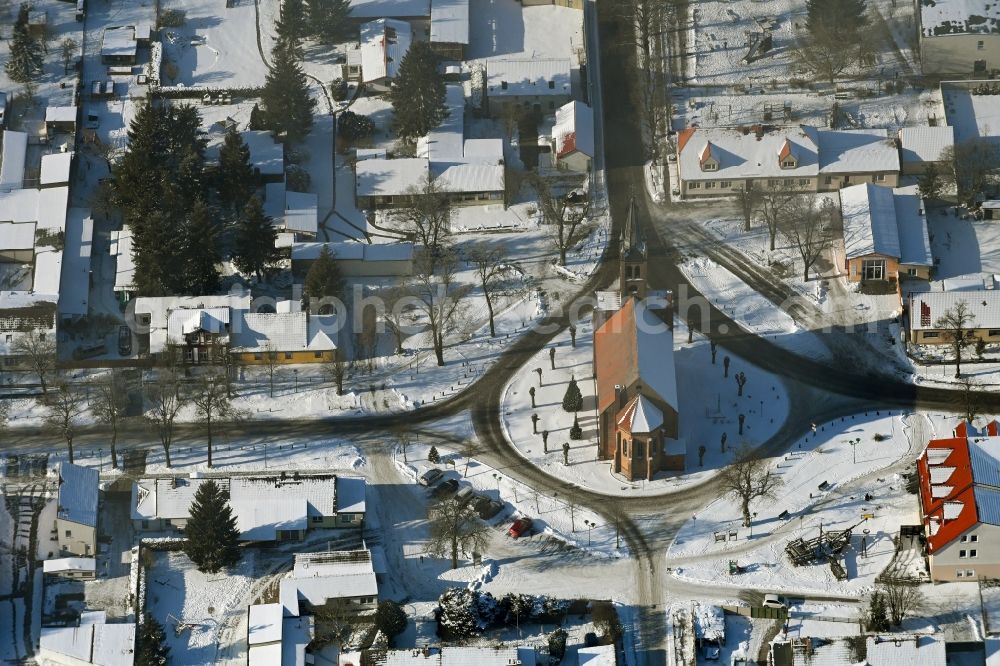 Marienwerder from above - Wintry snowy church building in the village of in Marienwerder in the state Brandenburg, Germany