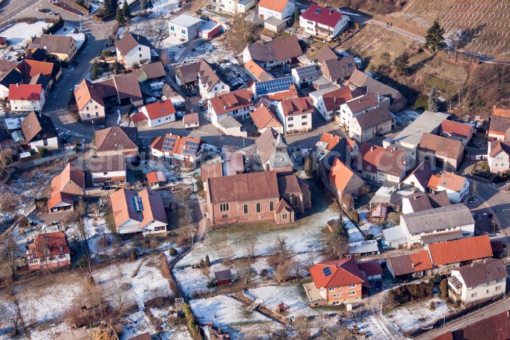 Kraichtal from the bird's eye view: Wintry snowy Church building in the village of in the district Neuenburg in Kraichtal in the state Baden-Wuerttemberg, Germany