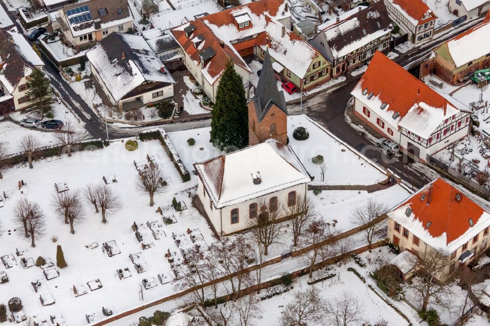 Winden from above - Wintry snowy Church building in the village of in Winden in the state Rhineland-Palatinate, Germany