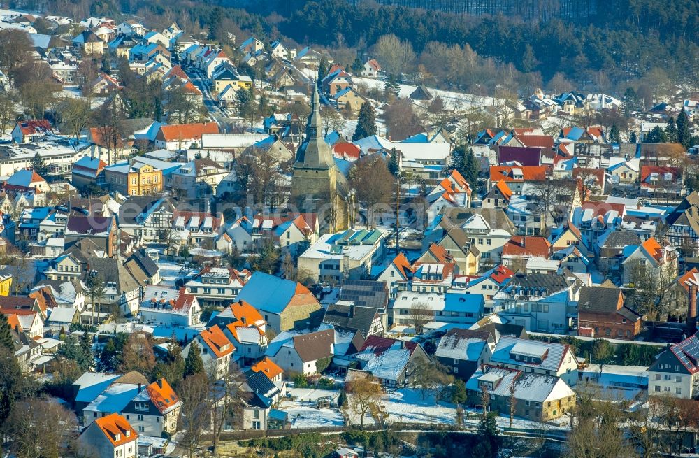 Aerial photograph Rüthen - Wintry snowy Church building St. Johannes Kirche in Ruethen in the state North Rhine-Westphalia